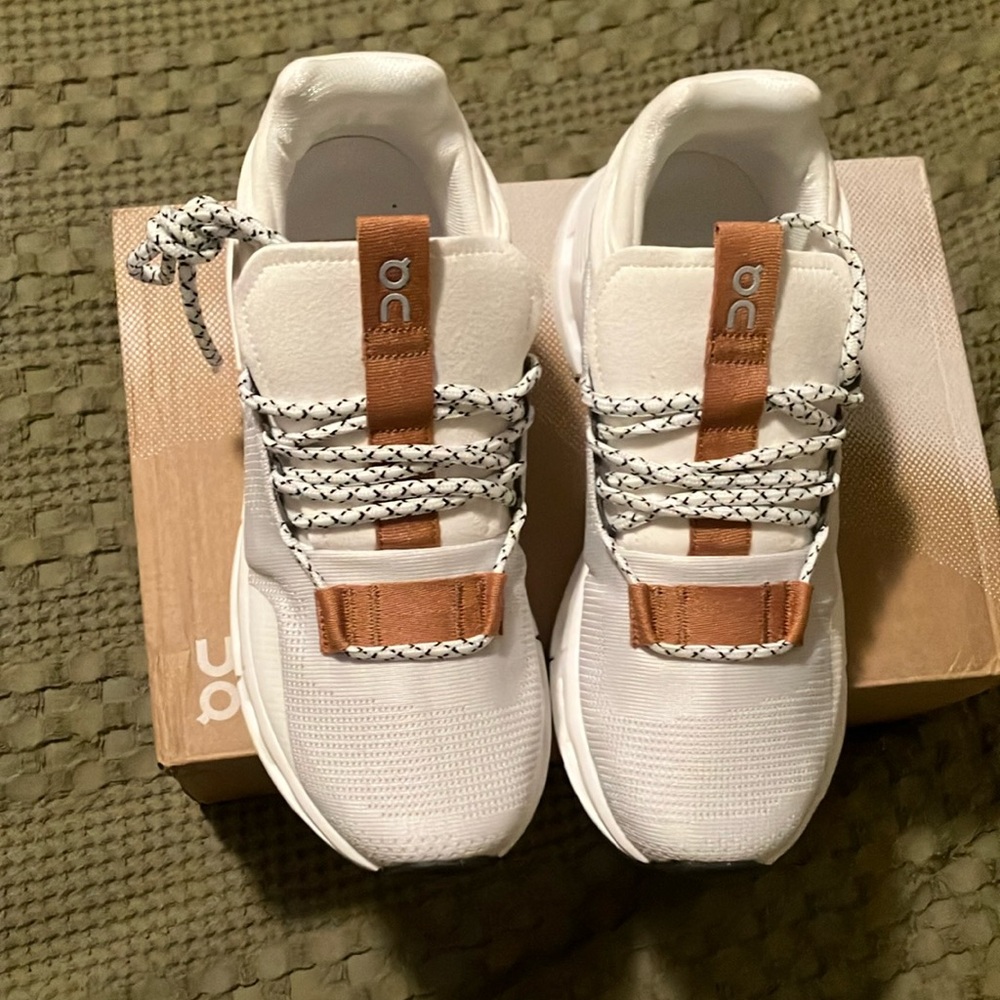 On Running White and Tan Athletic Shoes